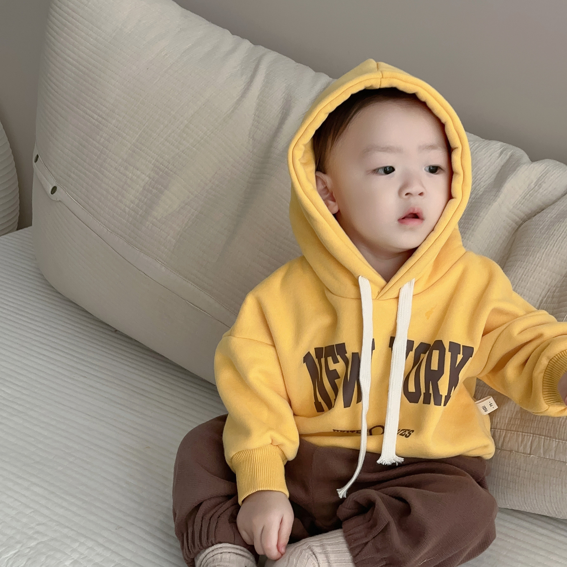 yellow sweatshirt